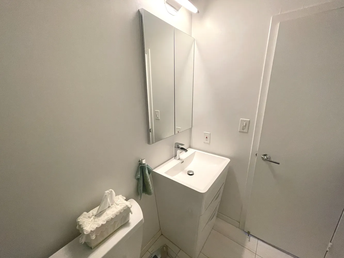 a bathroom with a sink and a mirror