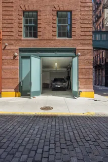 a view of a brick house with a yard