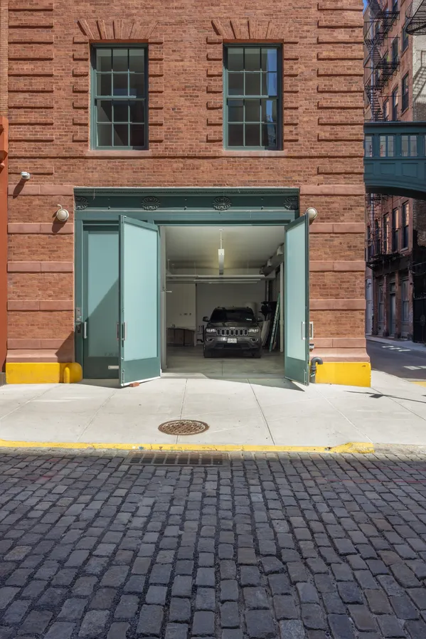 a view of a brick house with a yard