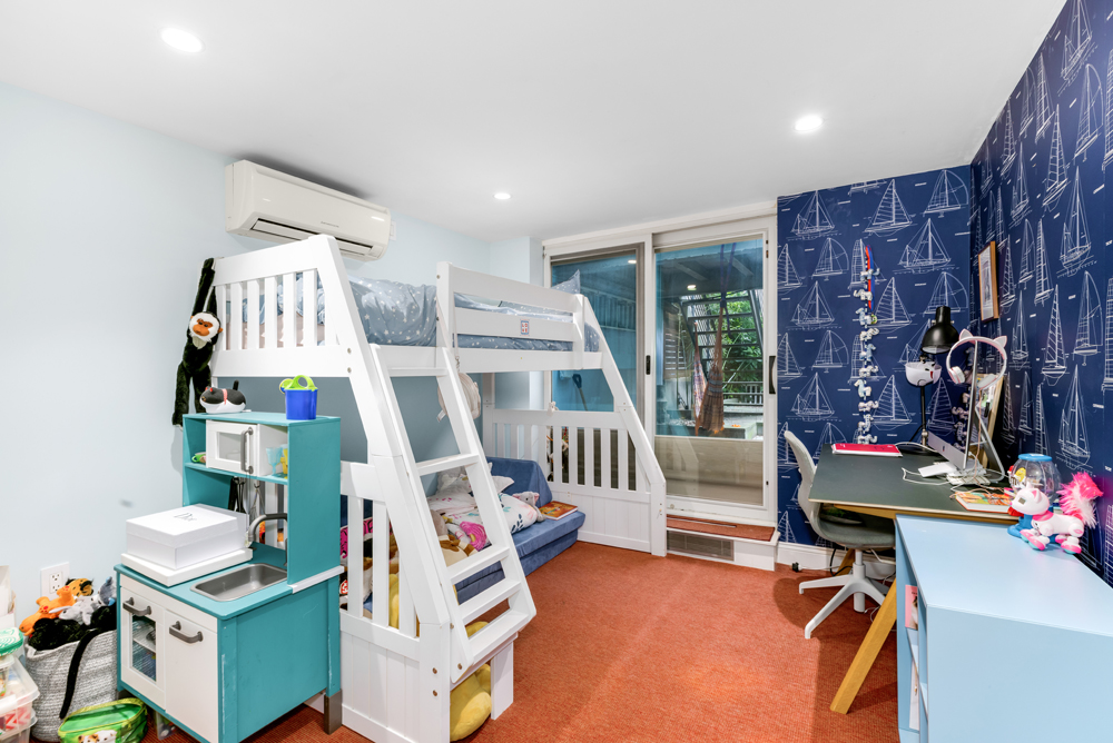 308 West 19th Street, Unit GARDEN Manhattan, NY 10011 - Photo 11 of 18 a room with furniture and gym equipment