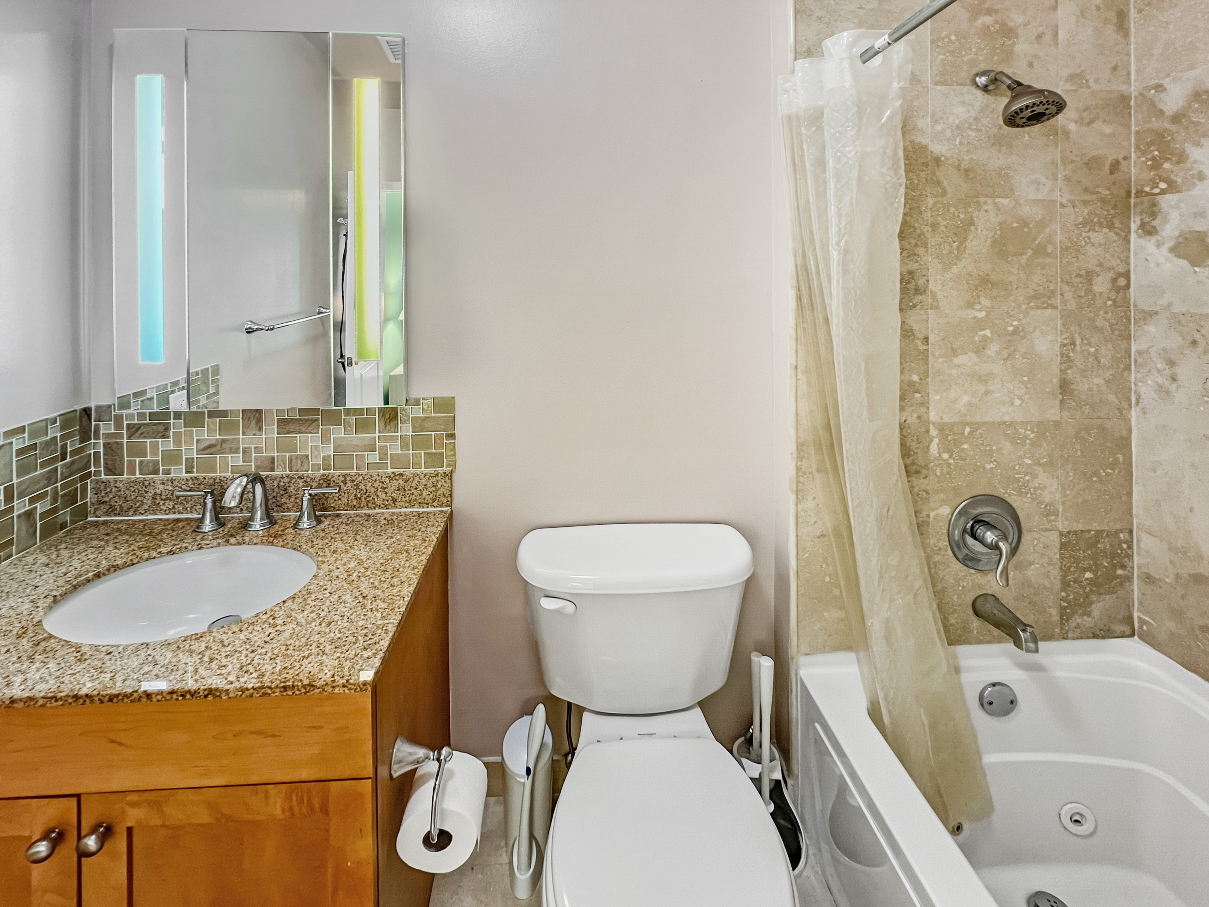1467 Royce Street, Unit 3L Brooklyn, NY 11234 - Photo 5 of 14 a bathroom with a granite countertop sink mirror vanity bathtub and a toilet