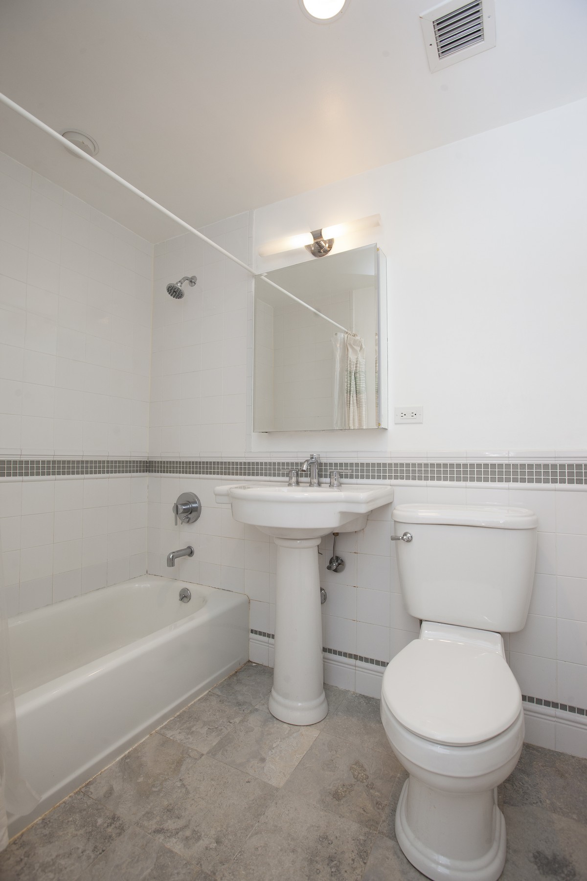 249 East 118th Street, Unit 3A Manhattan, NY 10035 - Photo 15 of 16 a bathroom with a sink a toilet and bathtub