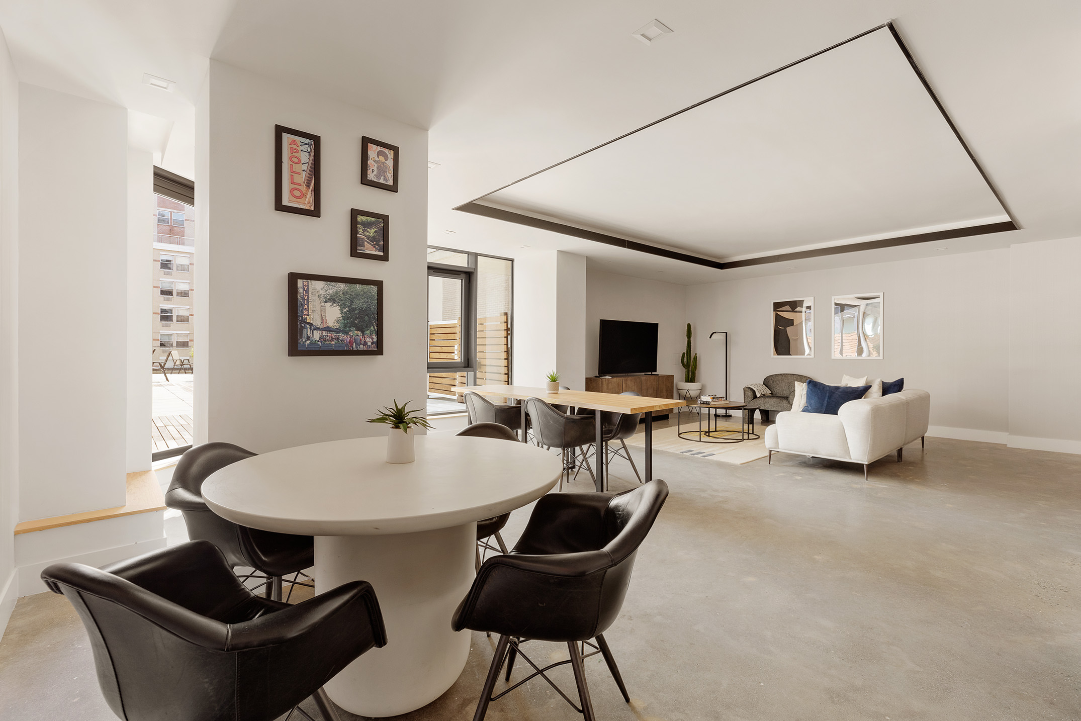 11 Hancock Place, Unit PH102 Manhattan, NY 10027 - Photo 16 of 18 a living room with furniture and a flat screen tv