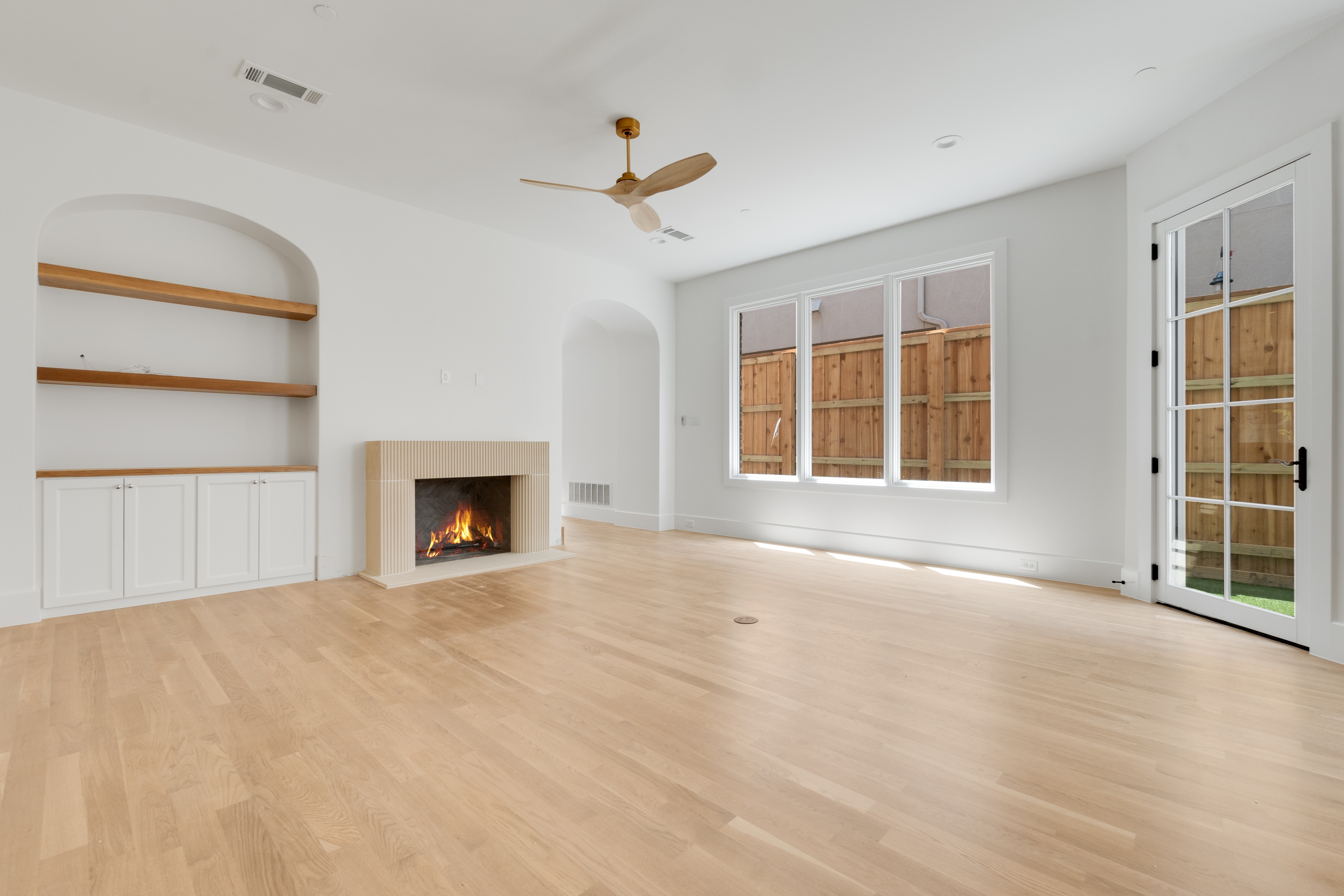 4410 Glenwick Lane Dallas, TX 75205 - Photo 12 of 28 a view of an empty room with a window and fireplace