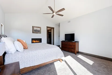 a bathroom with a glass door shower and yard