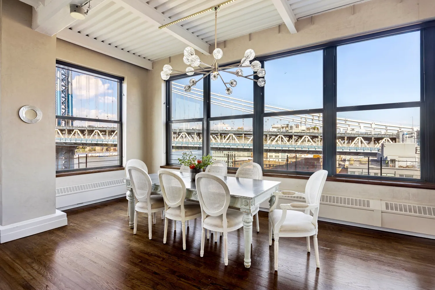 a view of a dining room with furniture window and wooden floor