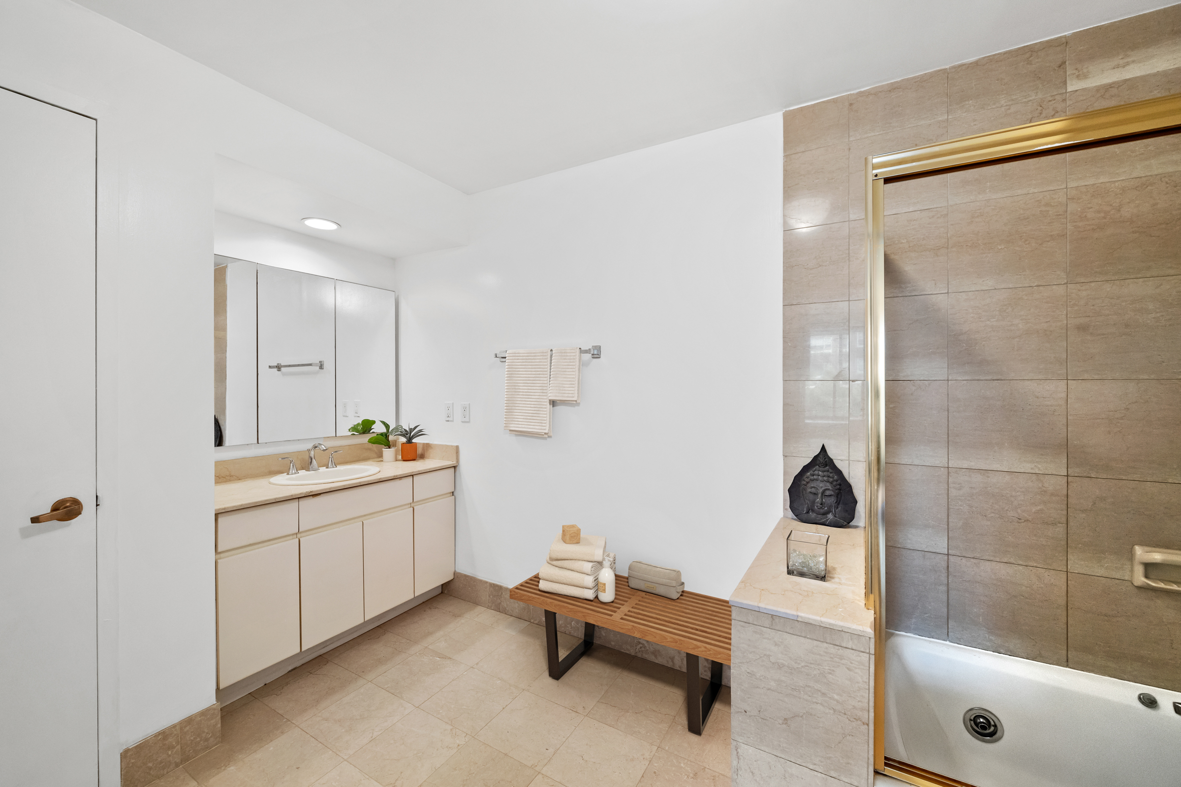 196 6th Avenue, Unit 5A Manhattan, NY 10013 - Photo 7 of 12 a bathroom with a tub sink and glass door