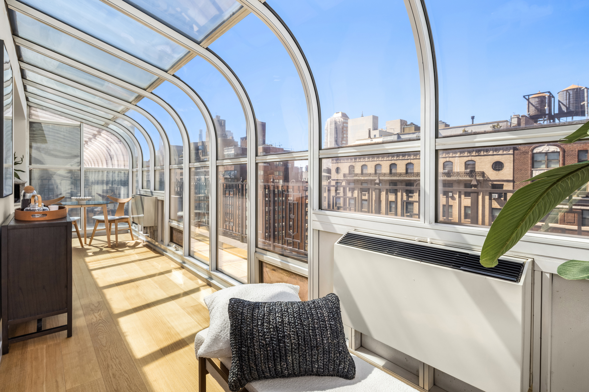 1049 Park Avenue, Unit PH Manhattan, NY 10028 - Photo 7 of 22 a view of a living room and a balcony