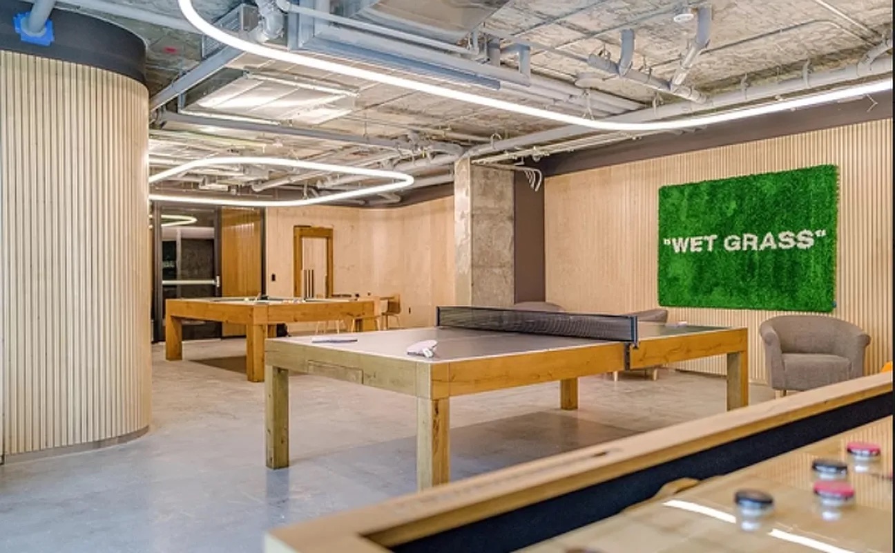 158 East 126th Street, Unit 730 Manhattan, NY 10035 - Photo 12 of 18 a view of a kitchen with a table and chairs