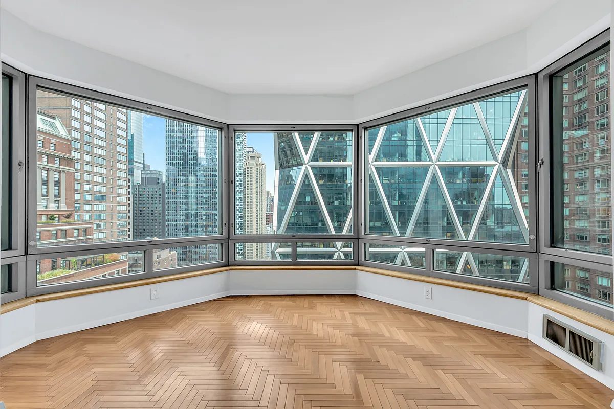 301 West 57th Street, Unit 22E Manhattan, NY 10019 - Photo 5 of 13 a view of an empty room with a large window