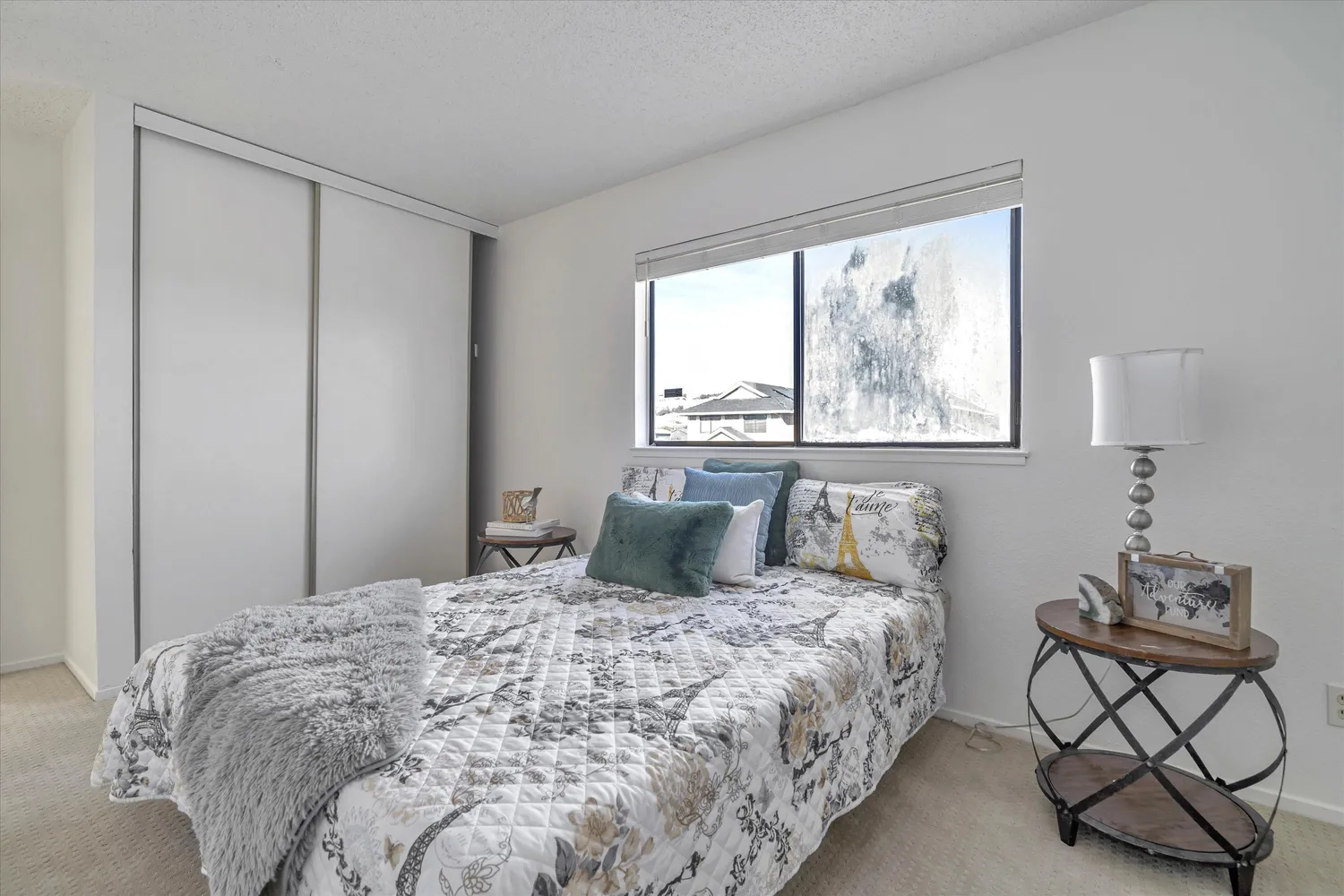 a bedroom with a bed and painted wall