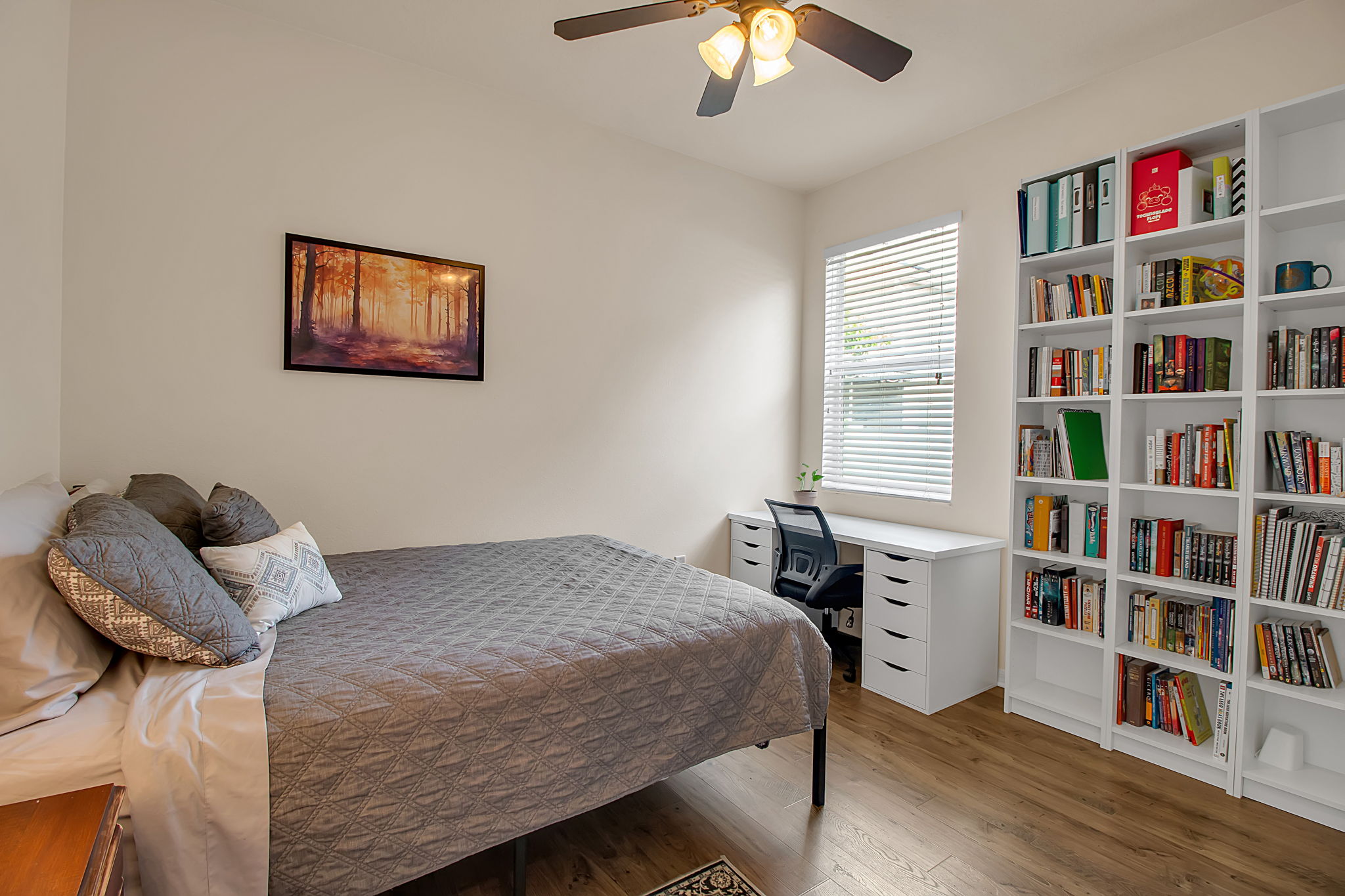 6106 34th Court East Bradenton, FL 34203 - Photo 47 of 69 a bedroom with a bed and a book shelf
