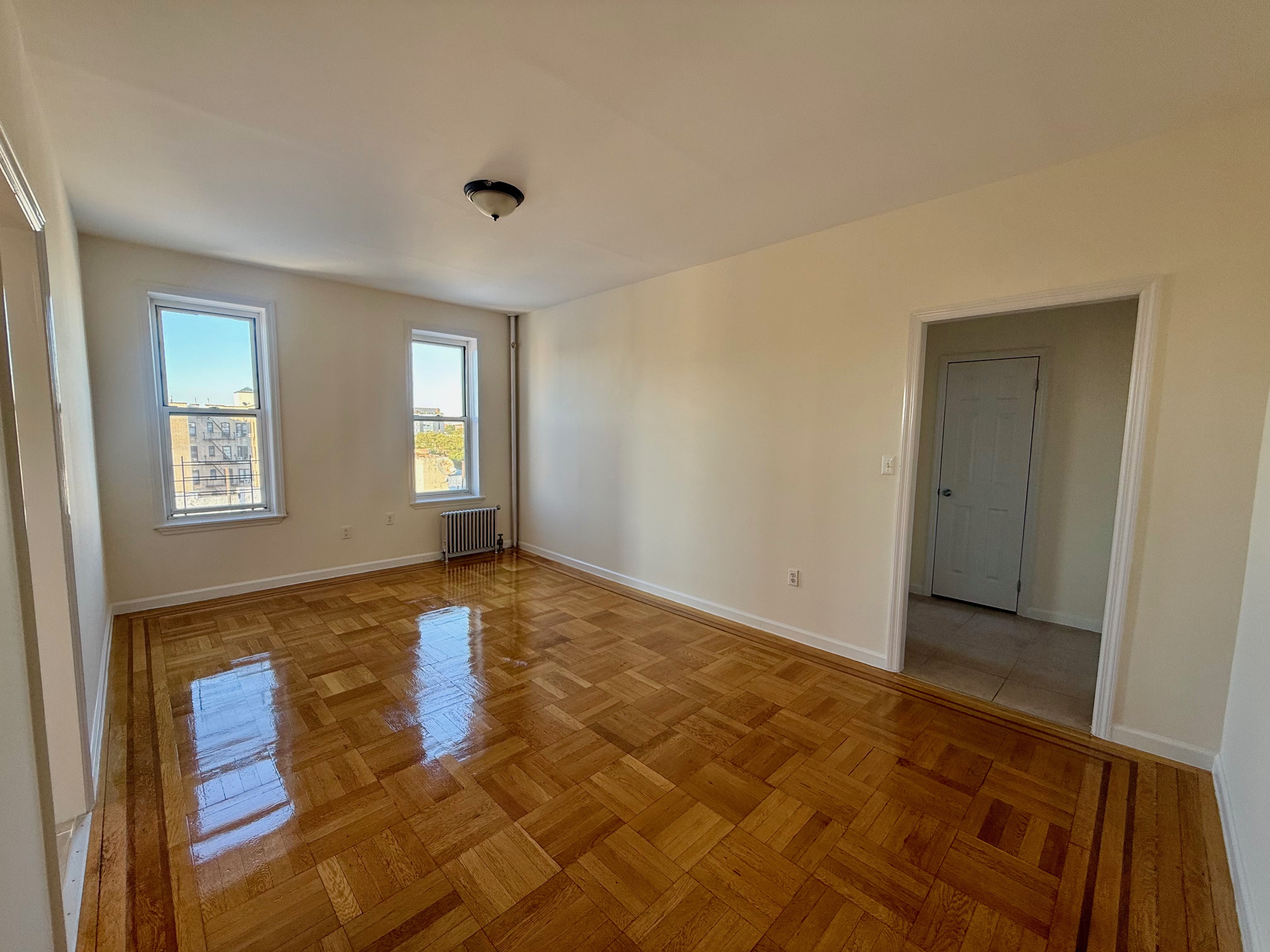 6309 Bay Parkway, Unit F5 Brooklyn, NY 11204 - Photo 3 of 7 a view of an empty room and window