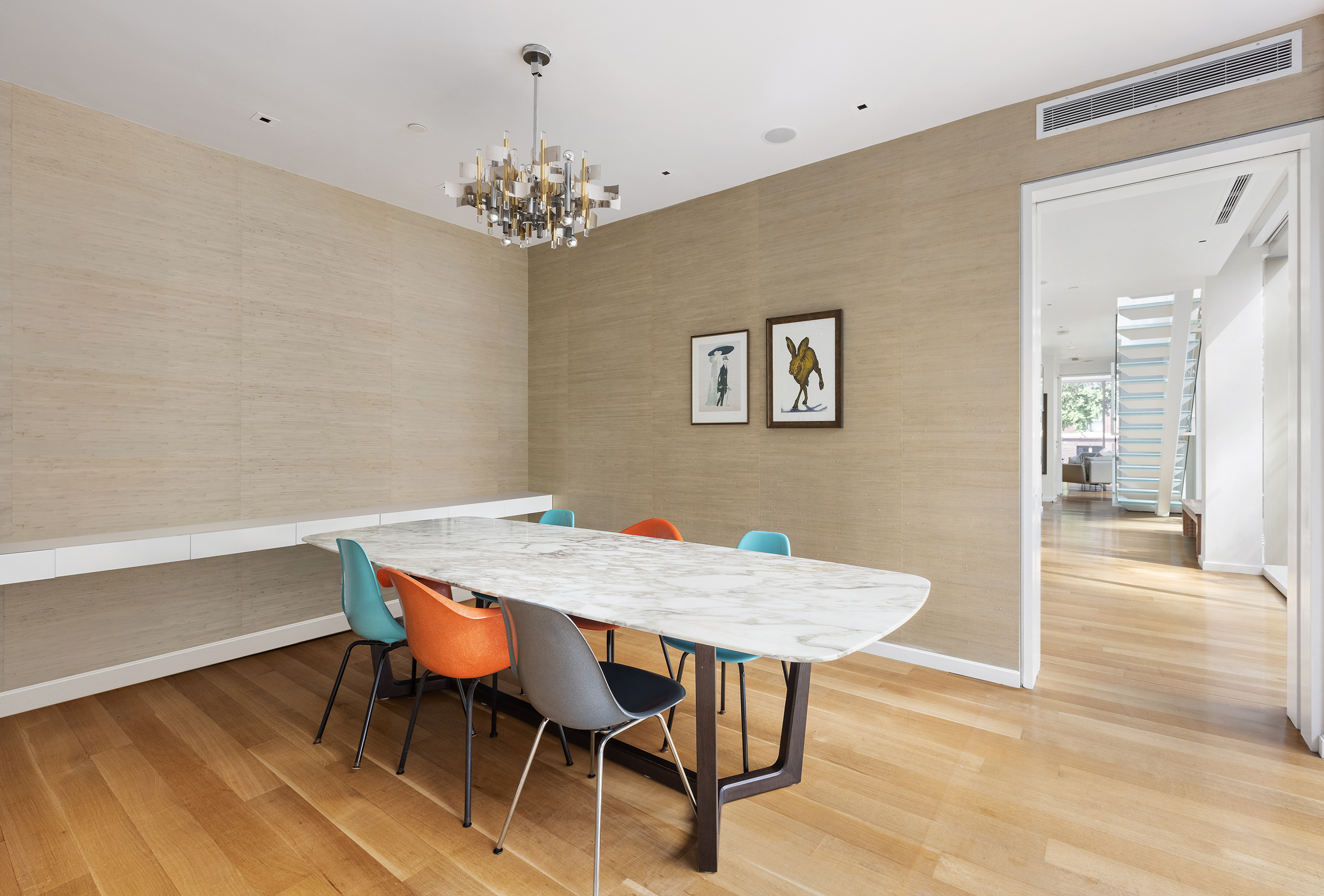 1055 Park Avenue, Unit 1 Manhattan, NY 10028 - Photo 7 of 19 a view of a dining room with furniture and chandelier