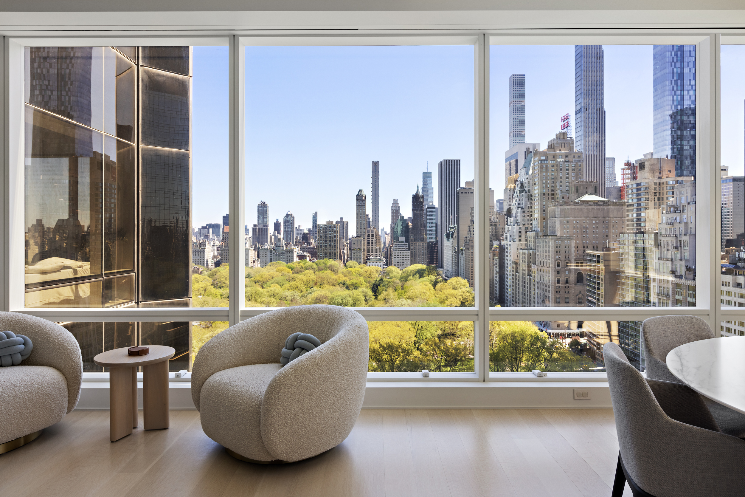 1 Central Park West, Unit 24D Manhattan, NY 10023 - Photo 1 of 19 a living room with furniture and a large window
