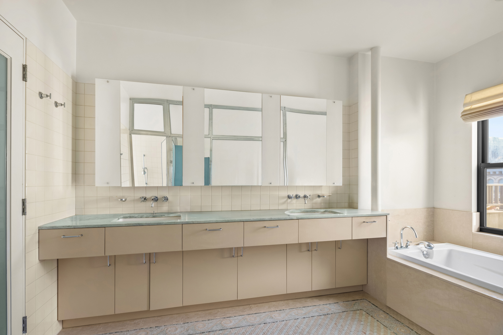 131 5th Avenue, Unit 801 Manhattan, NY 10003 - Photo 18 of 22 a bathroom with a bathtub a sink and a window