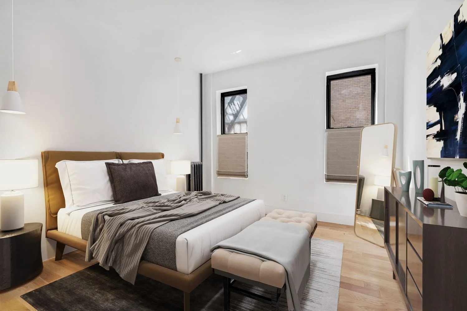 a bedroom with a bed and a lamp on table