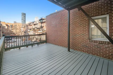 a view of terrace with wooden floor