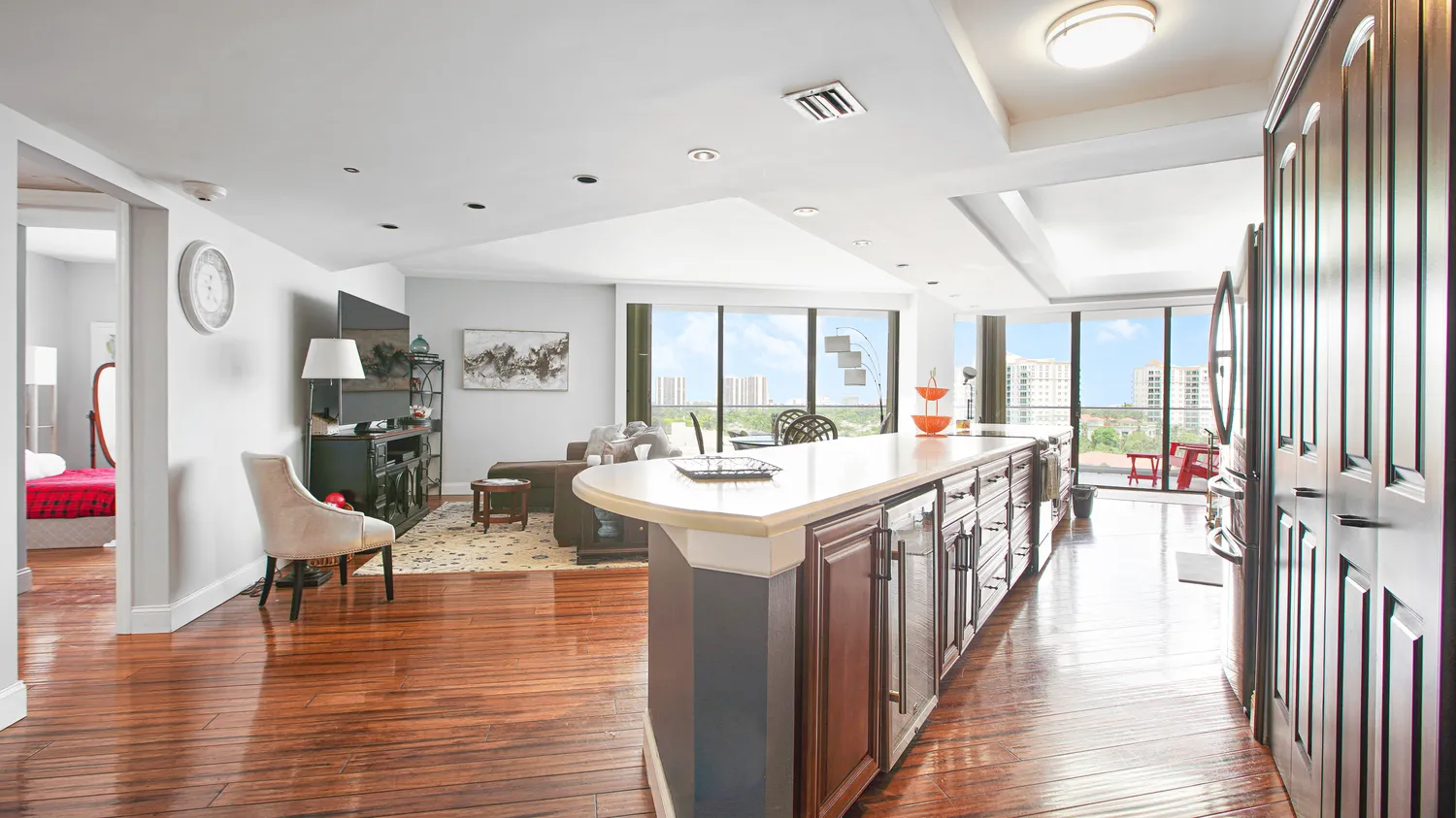 a very nice looking living room with wooden floor and furniture