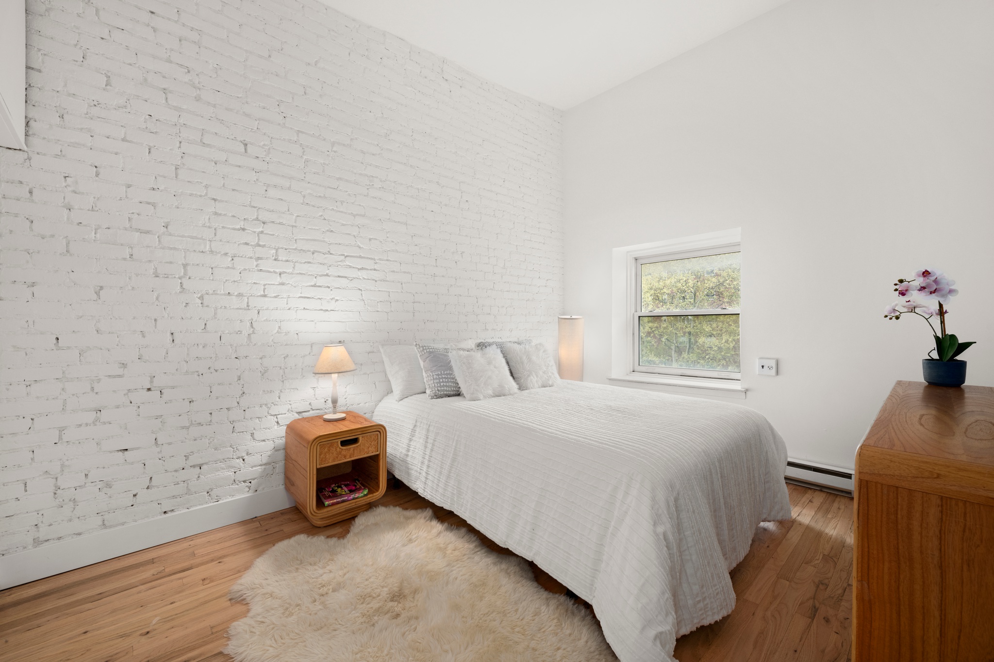 354 West 23rd Street, Unit 4A Manhattan, NY 10011 - Photo 5 of 7 a bedroom with a bed and a window