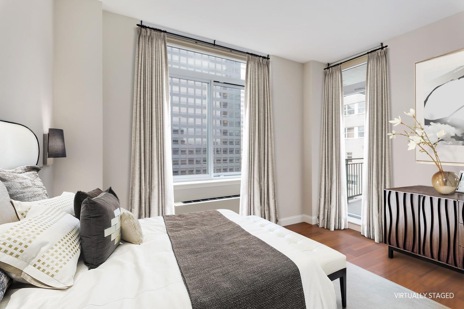 212 East 57th Street, Unit 18A Manhattan, NY 10022 - Photo 5 of 14 a bedroom with a bed and a window