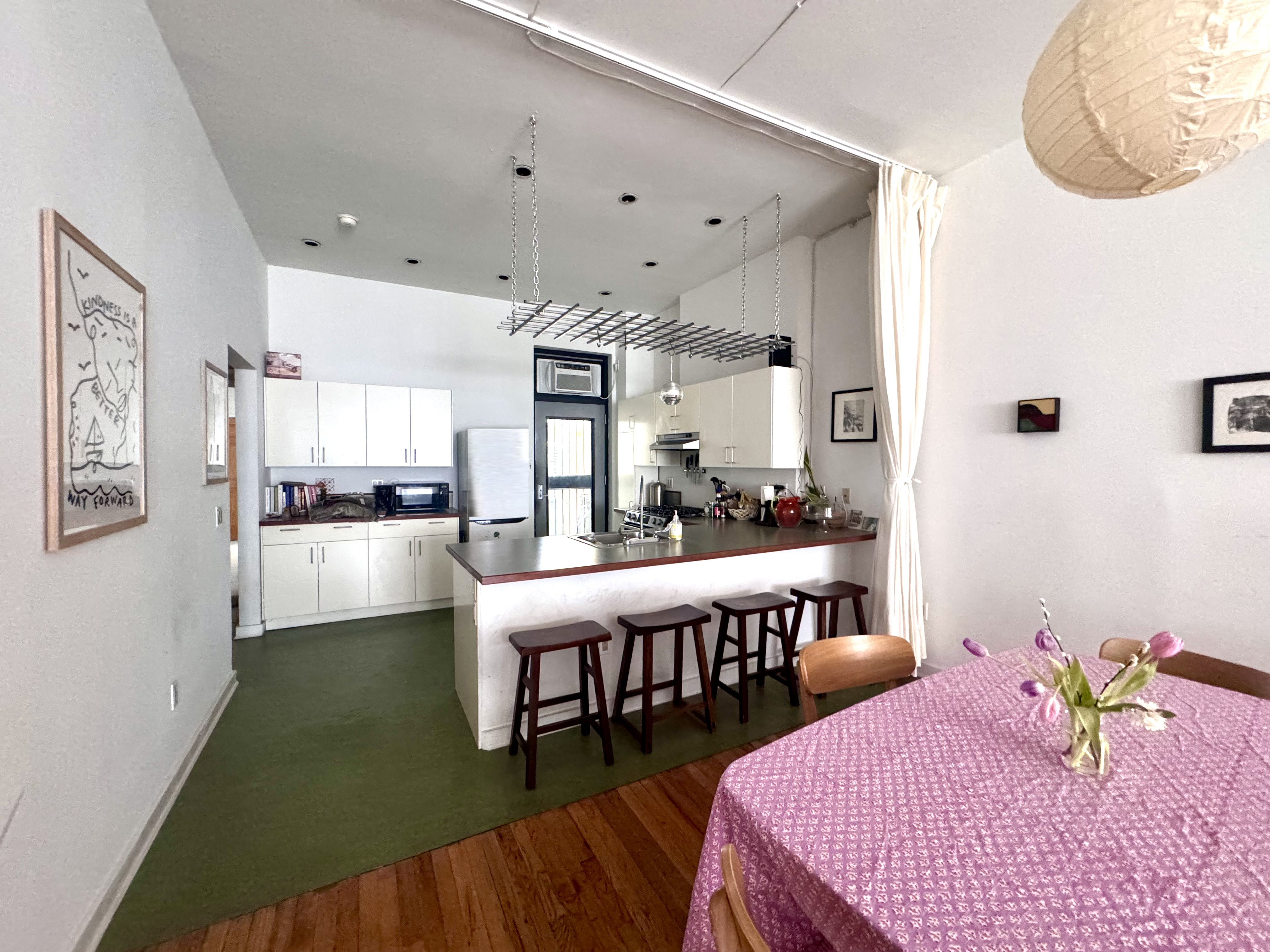 658 Classon Avenue Brooklyn, NY 11238 - Photo 6 of 15 a living room with dining room and wooden floor