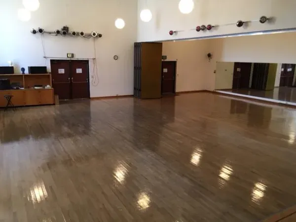 a view of a living room with hardwood floor