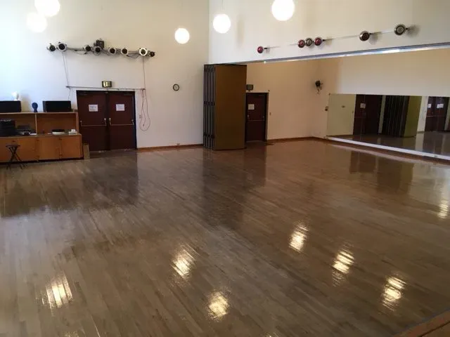 a view of a living room with hardwood floor