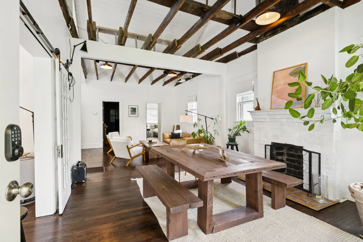 a view of a livingroom with furniture and a table