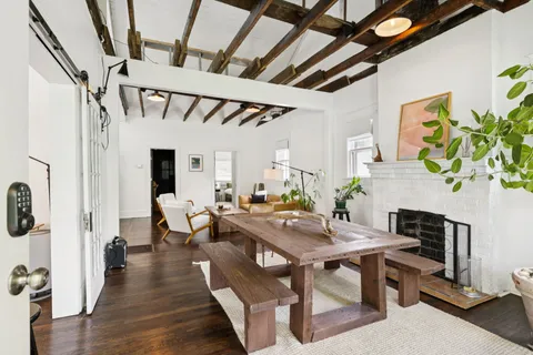 a view of a livingroom with furniture and a table