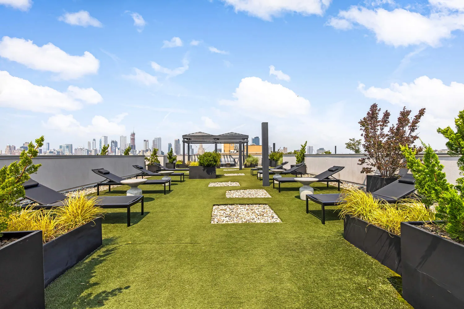 a view of swimming pool with outdoor seating and a garden