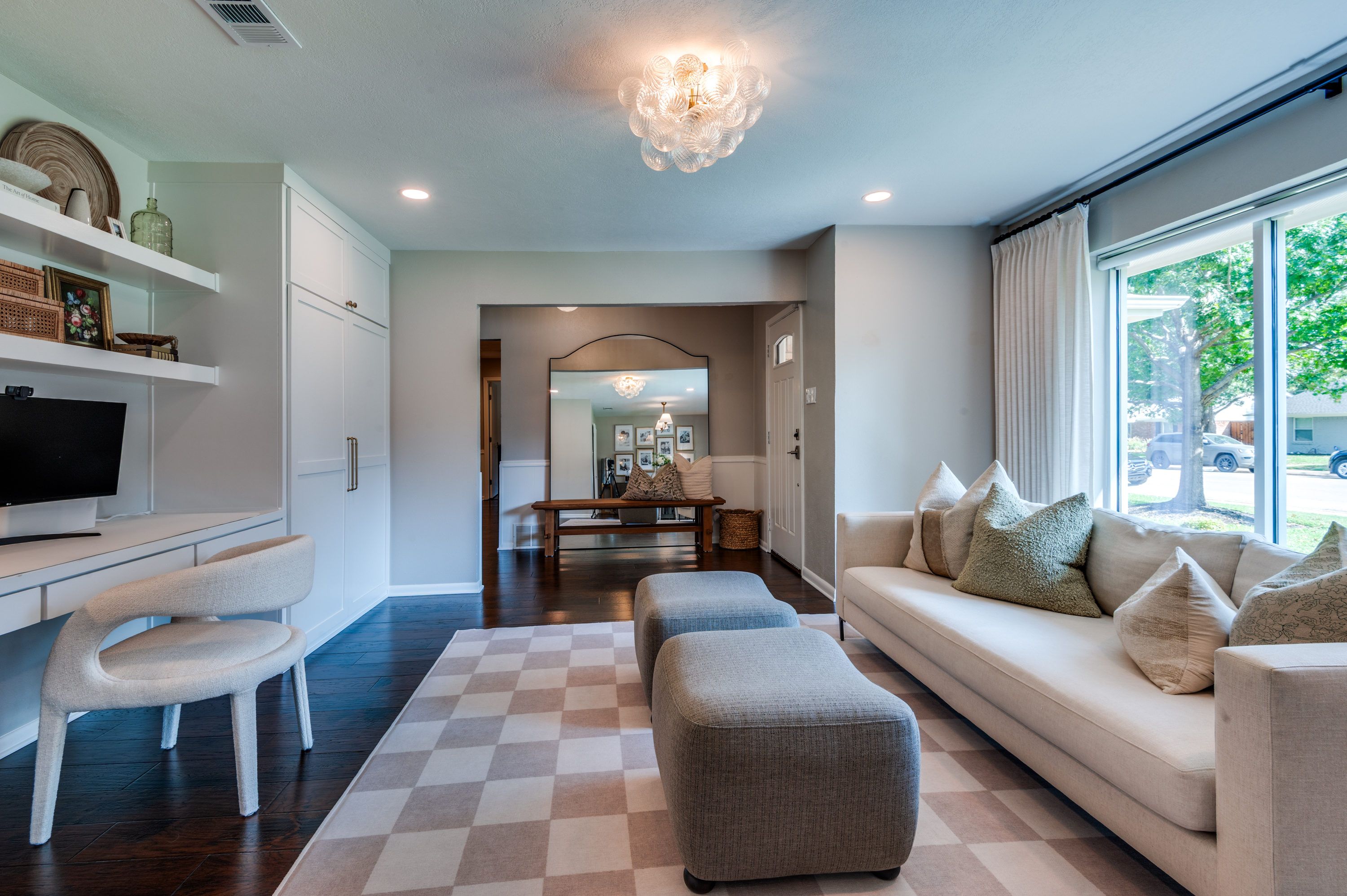 3363 Merrell Road Dallas, TX 75229 - Photo 3 of 29 a living room with furniture and a flat screen tv