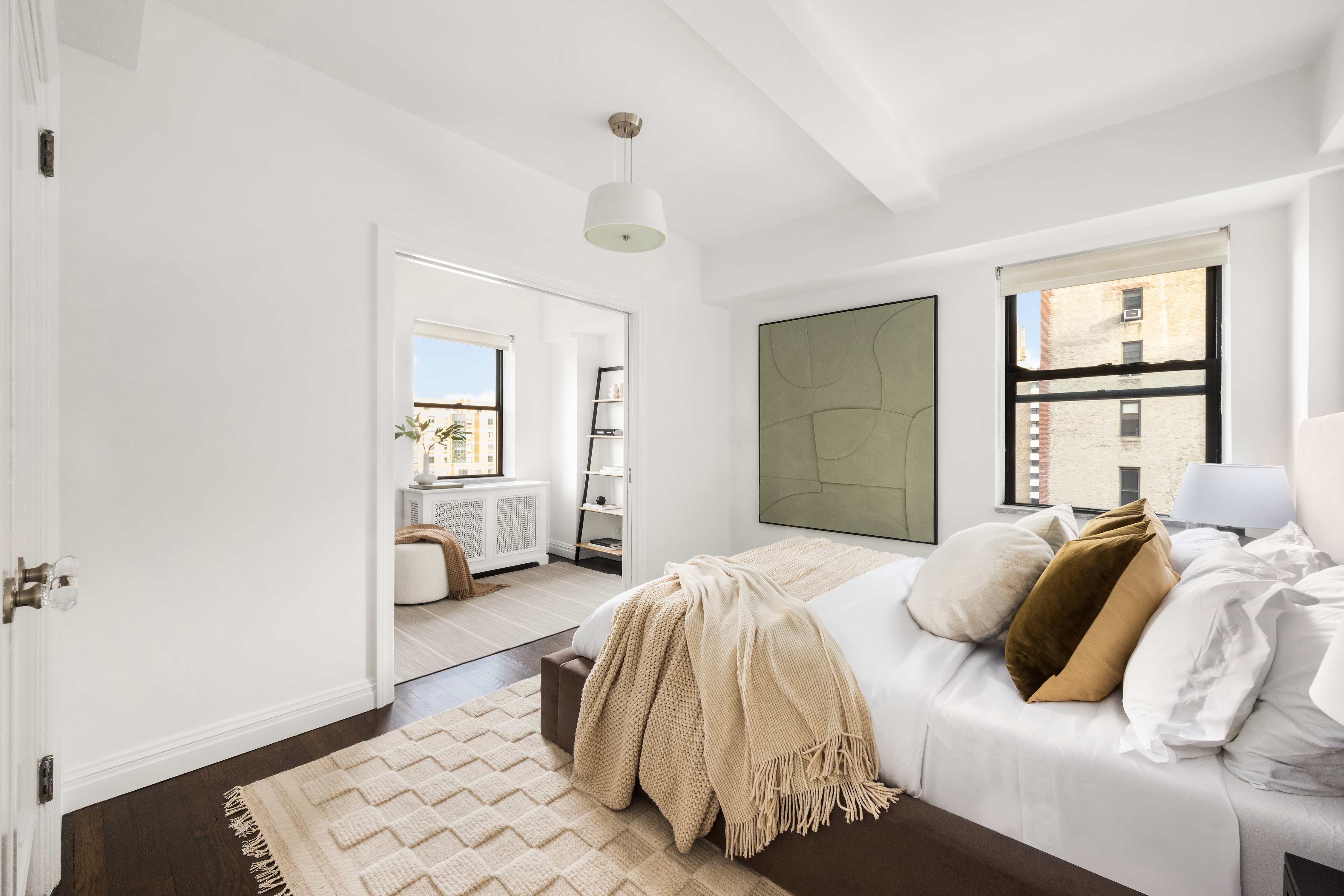 49 East 96th Street, Unit 9B Manhattan, NY 10128 - Photo 12 of 15 a bedroom with a bed and a window