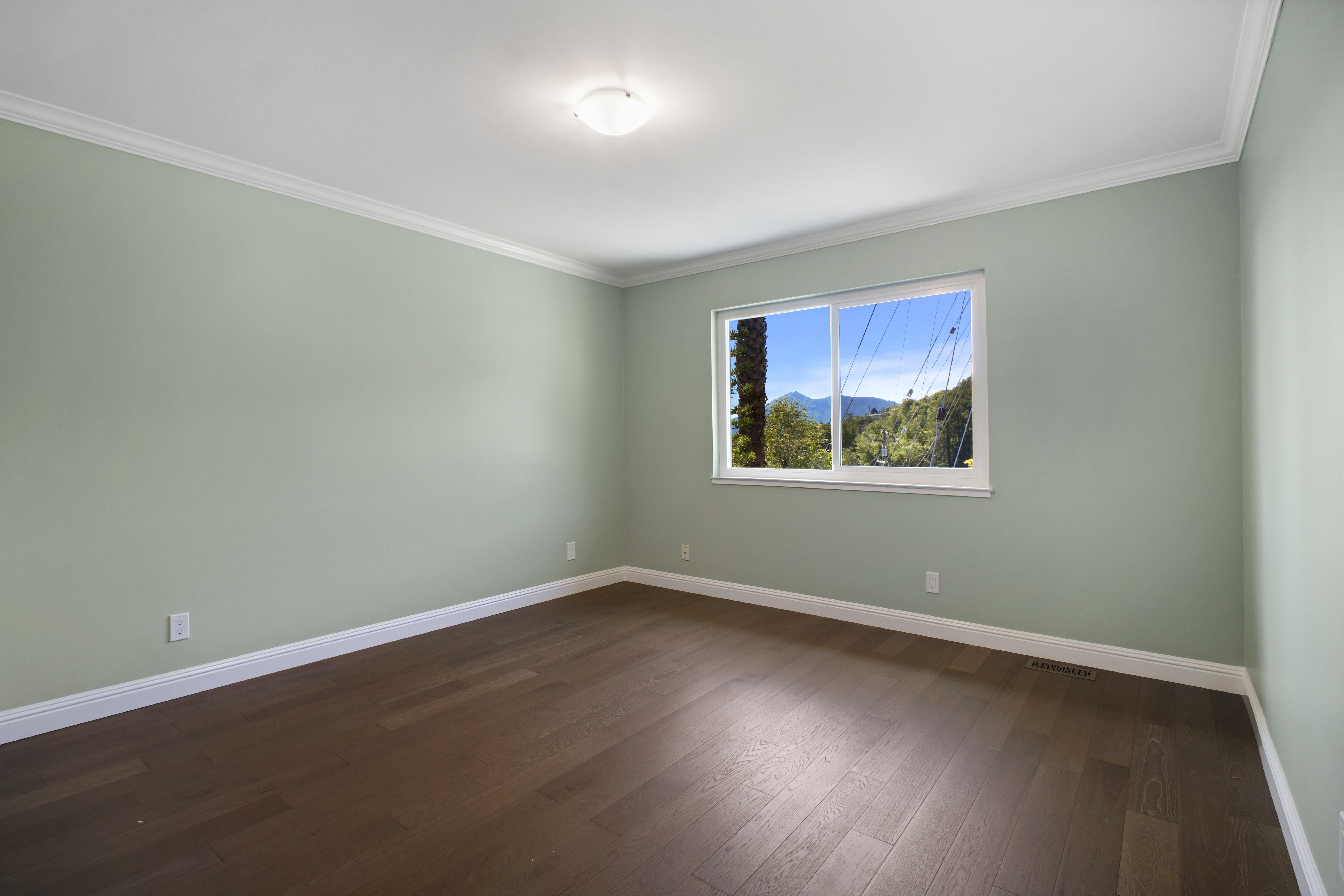 62 Oakdale Avenue San Rafael, CA 94901 - Photo 25 of 32 a view of an empty room with wooden floor and a window