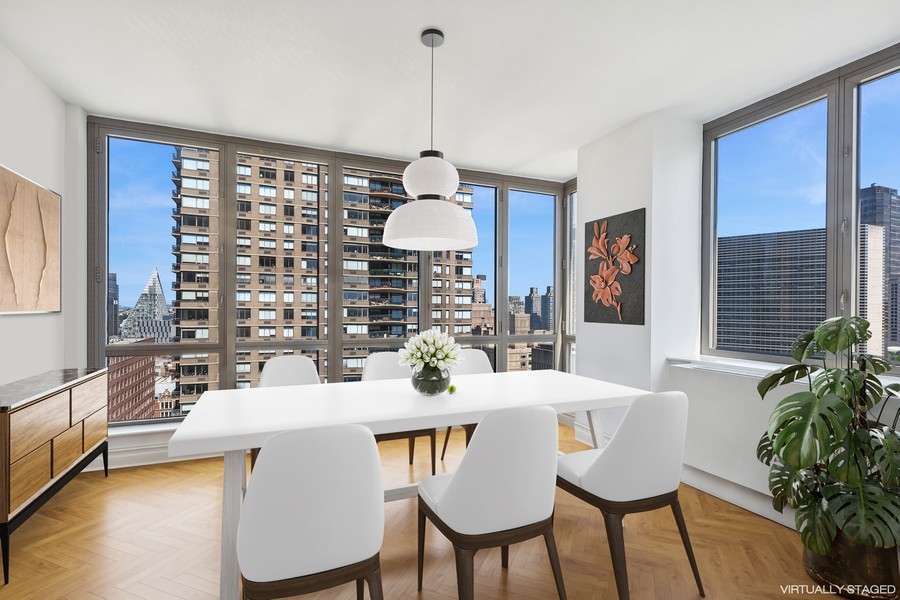 2 Columbus Avenue, Unit 23A Manhattan, NY 10019 - Photo 3 of 10 a dining room with furniture window and wooden floor