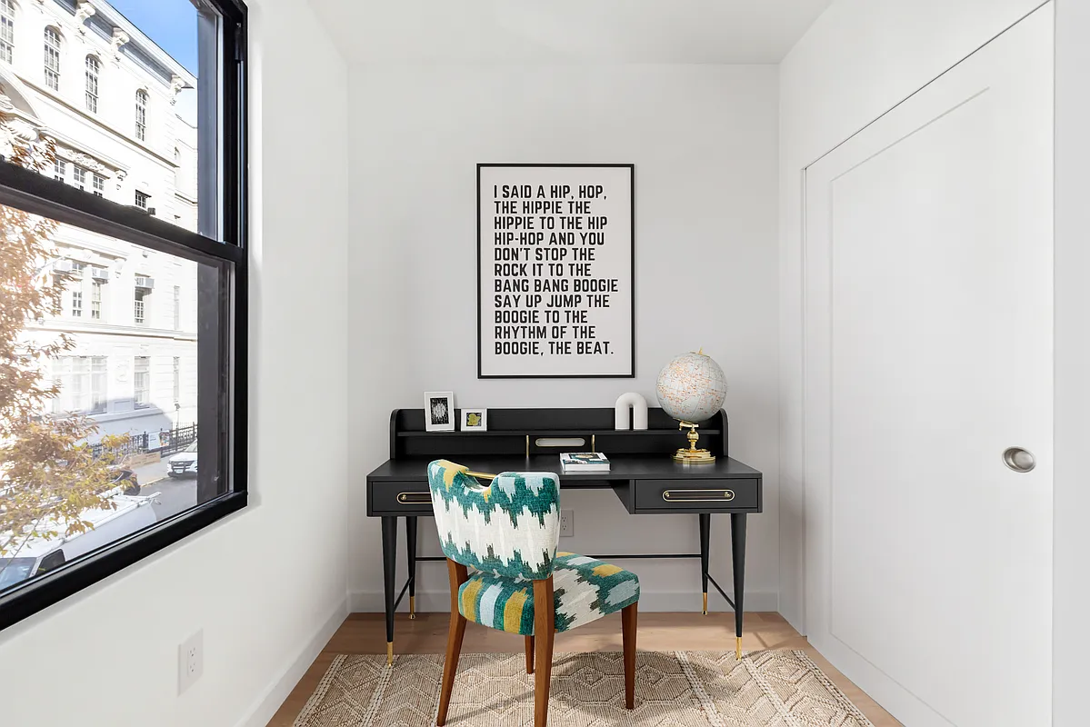 76 Meserole Avenue, Unit 2A Brooklyn, NY 11222 - Photo 9 of 10 a view of a workspace with furniture and a window