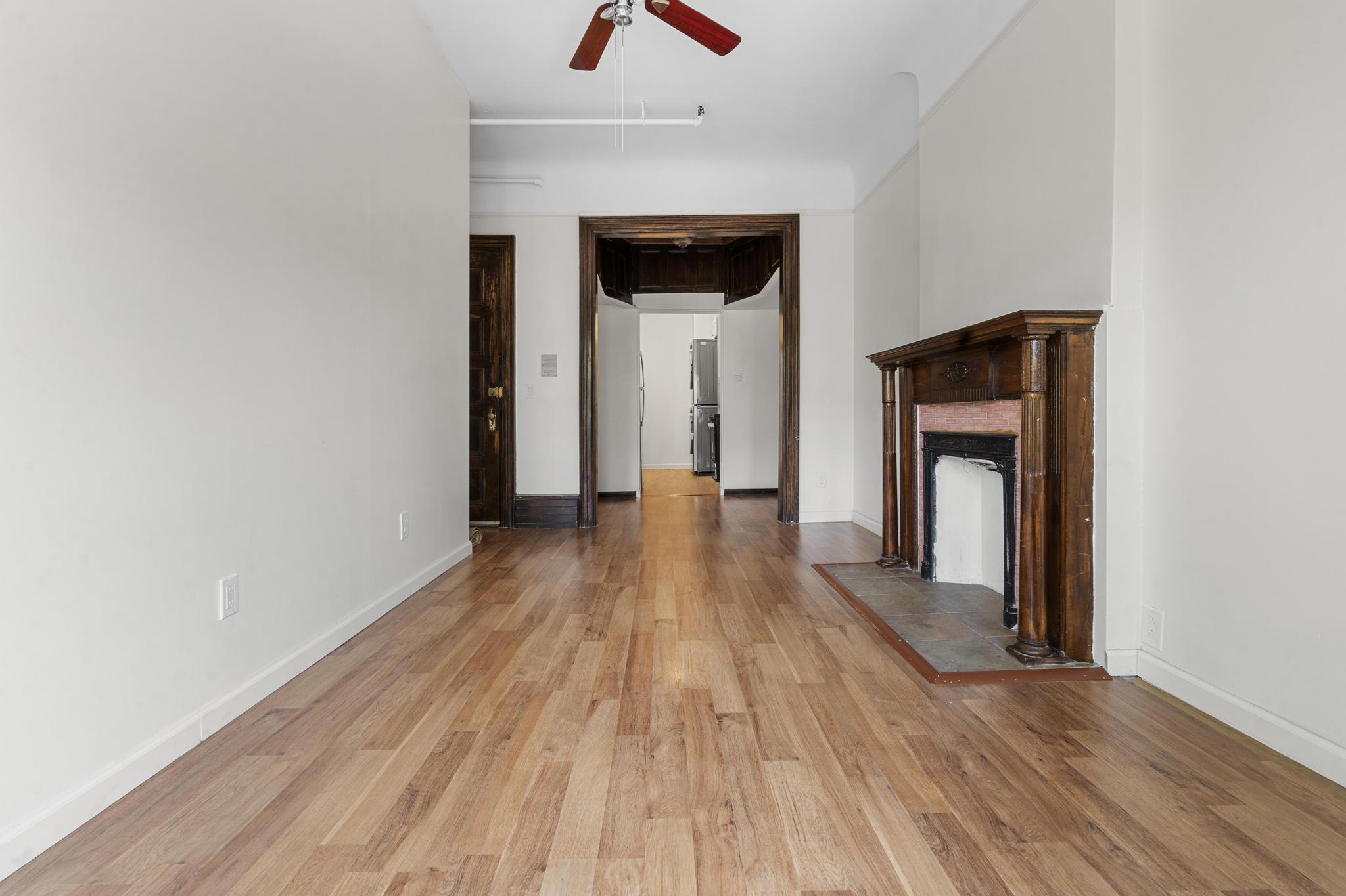 880 Park Place, Unit 2 Brooklyn, NY 11216 - Photo 5 of 12 a view of hallway with wooden floor