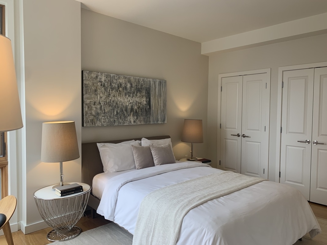 548 4th Avenue, Unit 4B Brooklyn, NY 11215 - Photo 10 of 22 a bedroom with a bed and a painting on the wall