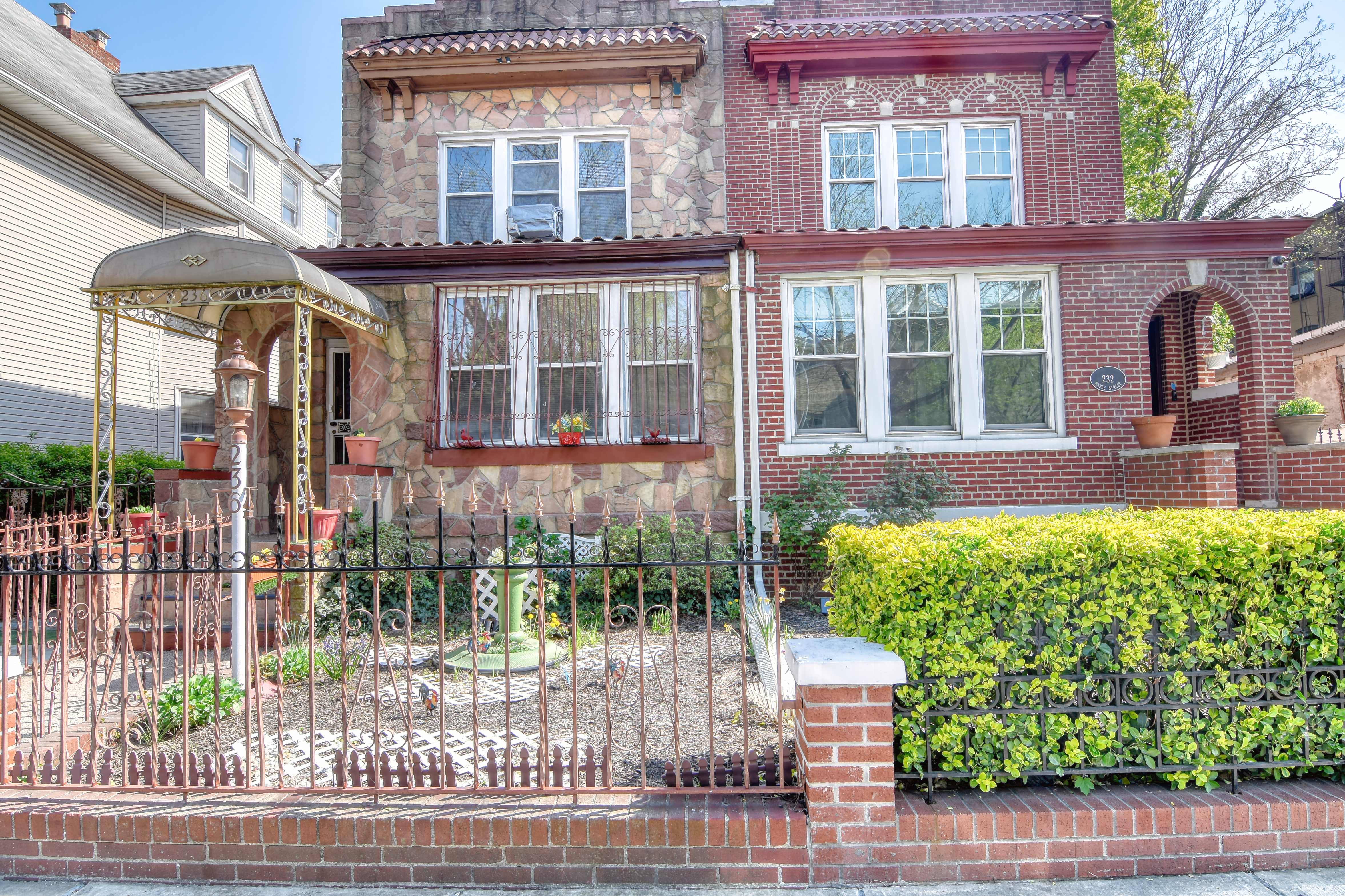 236 Maple Street Brooklyn, NY 11225 - Photo 2 of 2 front view of a brick house with a large window