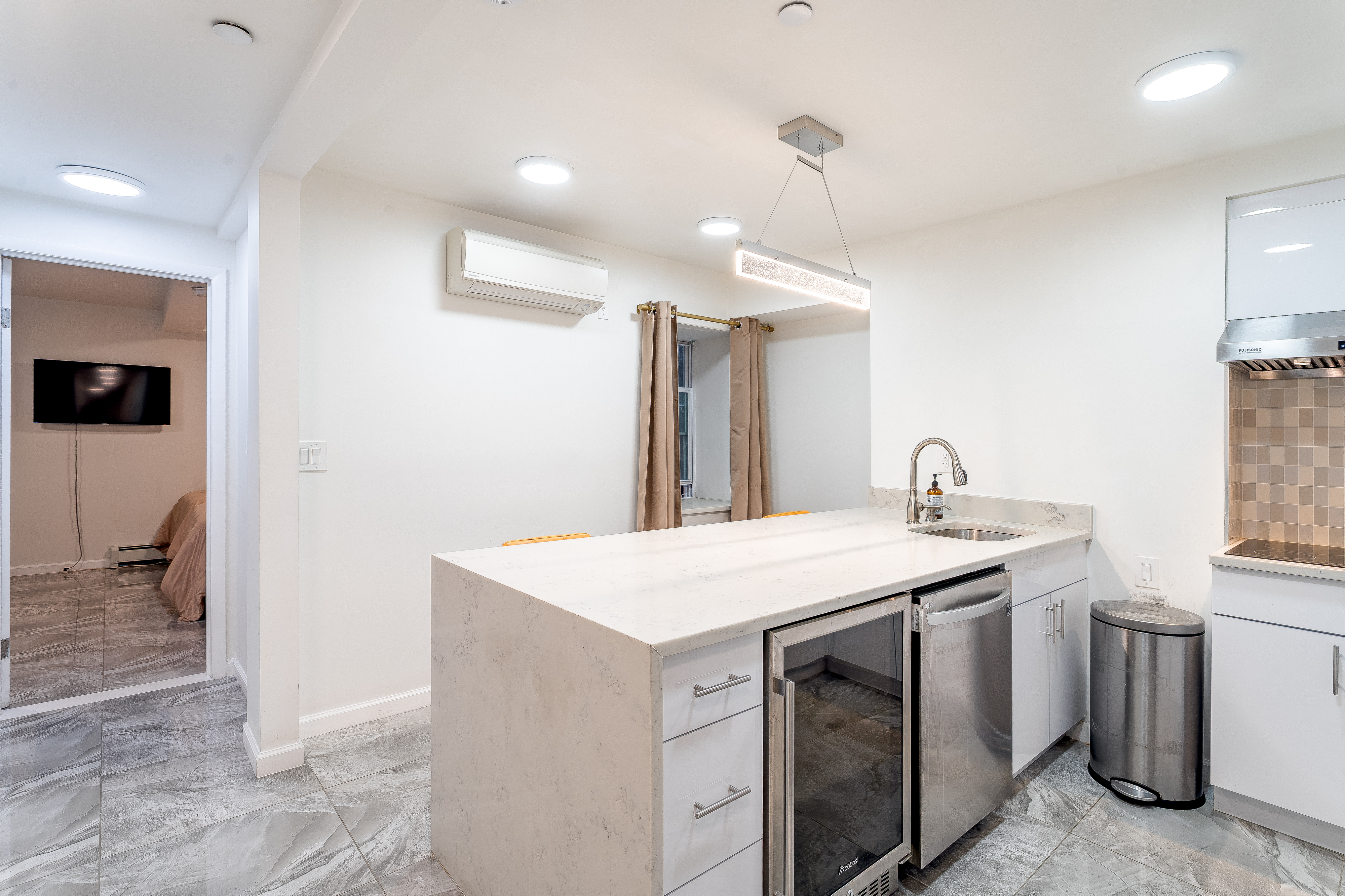 212 East 70th Street, Unit B Manhattan, NY 10021 - Photo 9 of 17 a utility room with a sink a washer and dryer