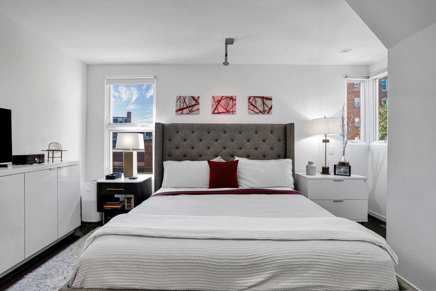 1630 19th Street Northwest, Unit C Washington, DC 20009 - Photo 20 of 45 a bedroom with a large bed and a tv