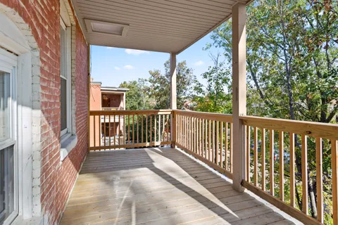 a view of a two chairs in the balcony