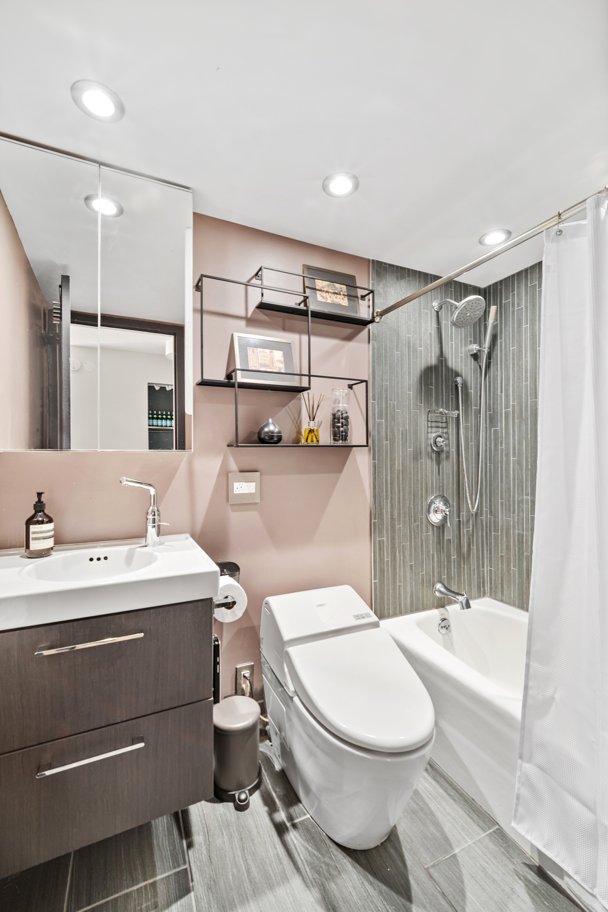 1 Irving Place, Unit U21E Manhattan, NY 10003 - Photo 8 of 16 a bathroom with a sink a toilet and shower