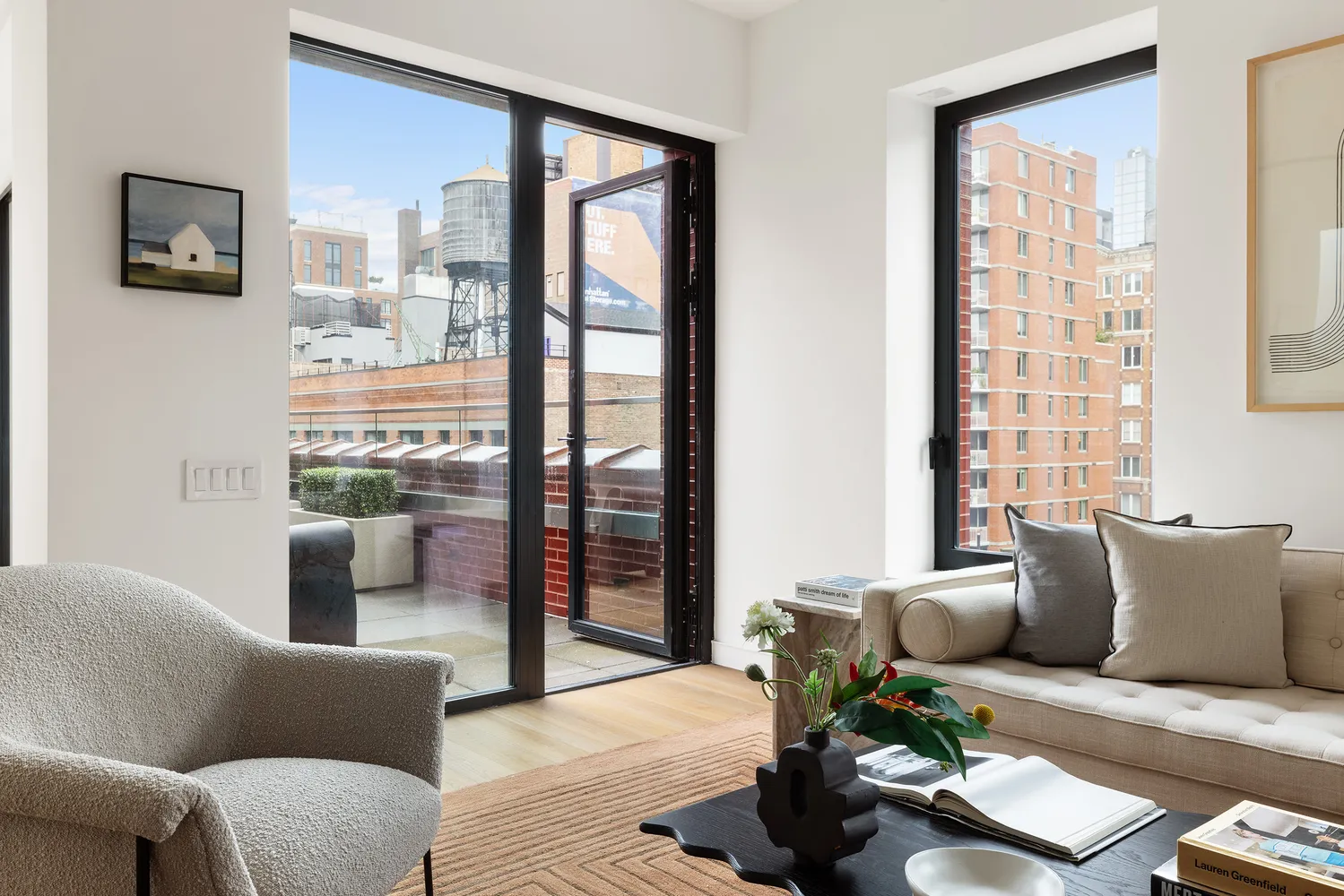 a living room with furniture and a floor to ceiling window