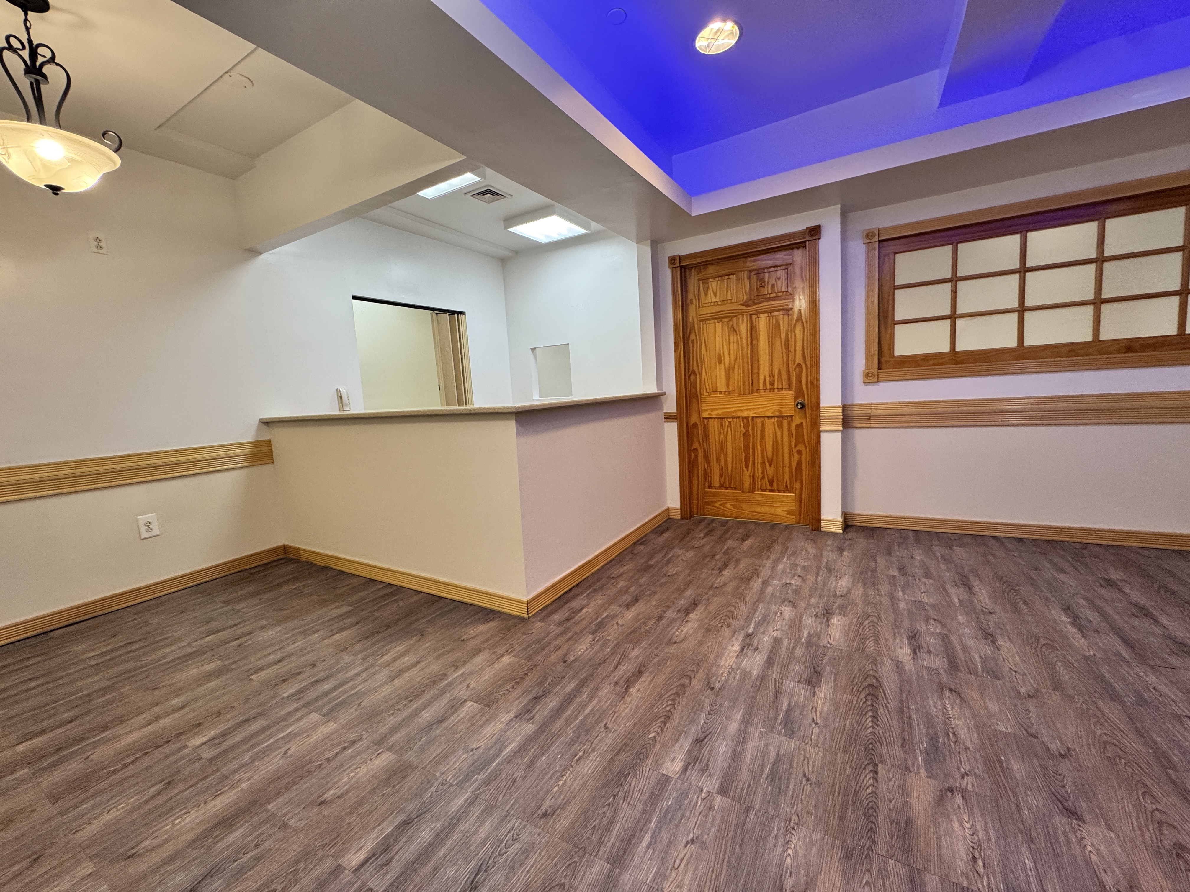 406 15th Street, Unit M1 Brooklyn, NY 11215 - Photo 2 of 19 a view of an empty room with wooden floor and a window