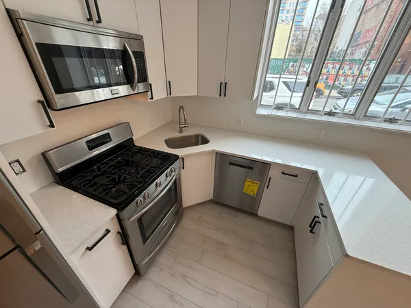 a kitchen with a stove and a microwave