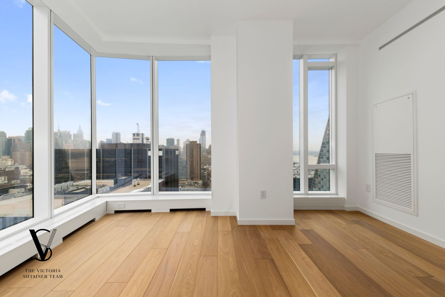 1 West End Avenue, Unit 28C Manhattan, NY 10023 - Photo 12 of 26 a view of a living room with floor to ceiling window and wooden floor