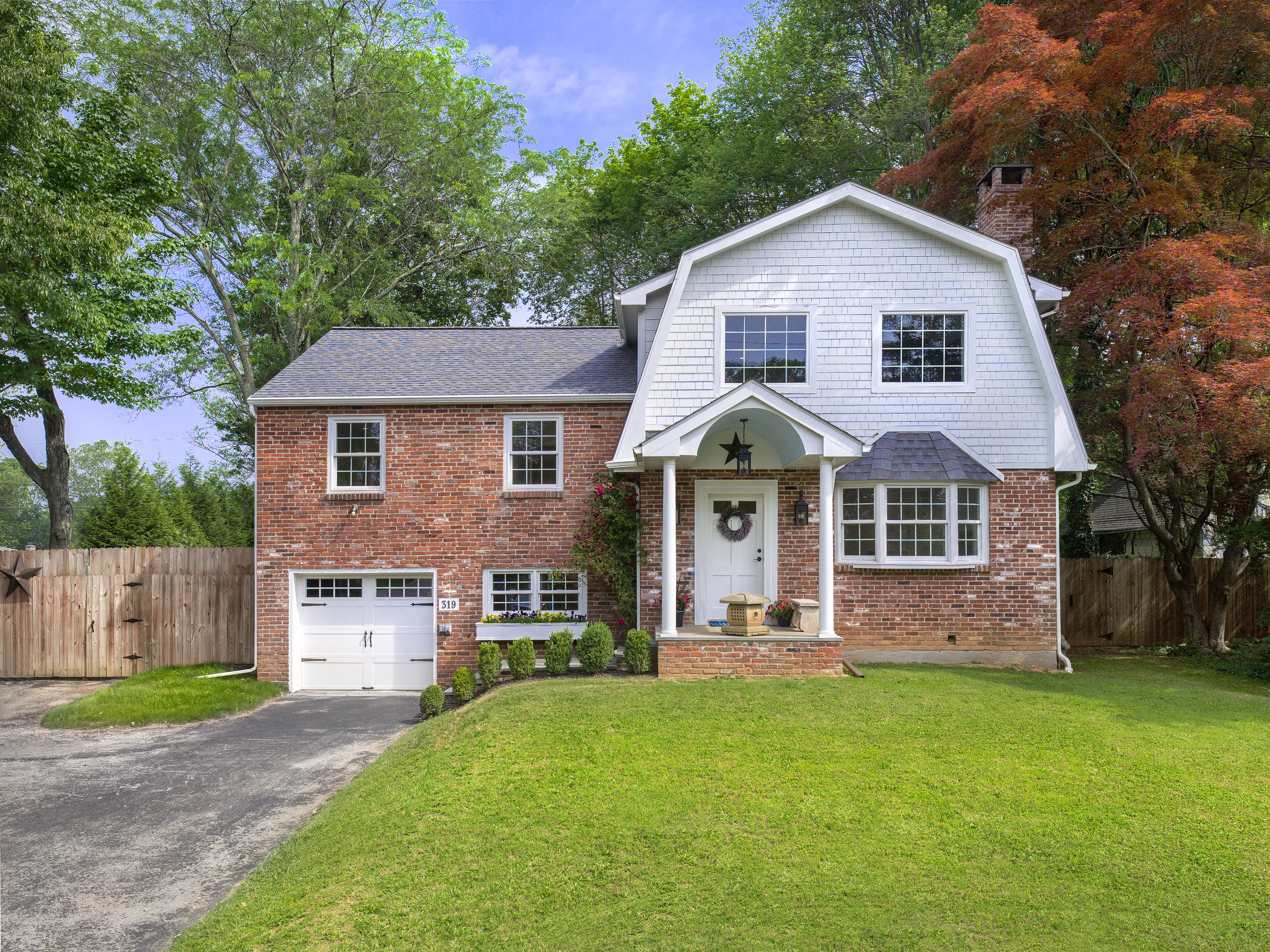 319 West Conestoga Road Devon, PA 19333 - Photo 1 of 38 a front view of a house with a yard