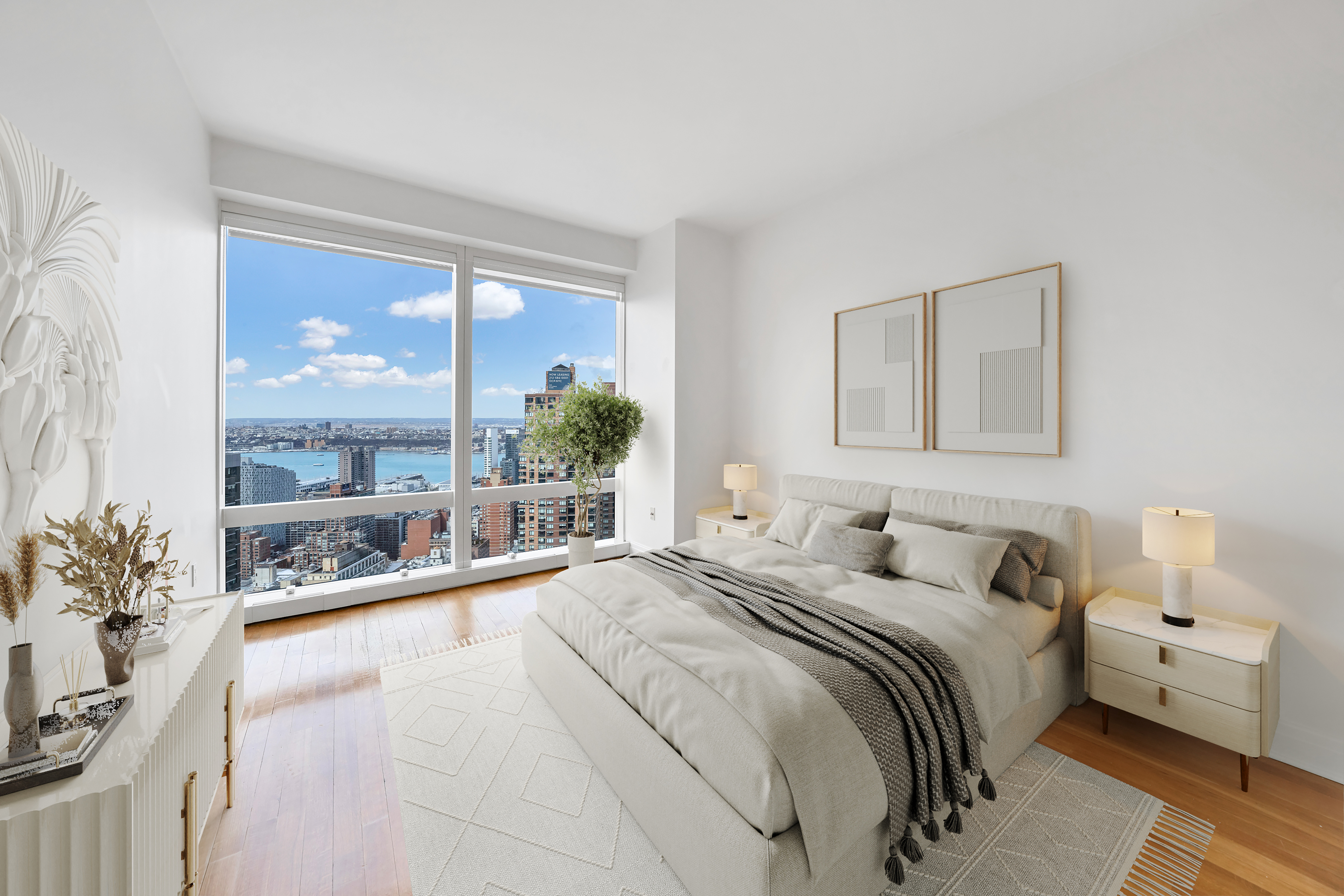25 Columbus Circle, Unit 59F Manhattan, NY 10019 - Photo 5 of 15 a bedroom with a large bed and a large window