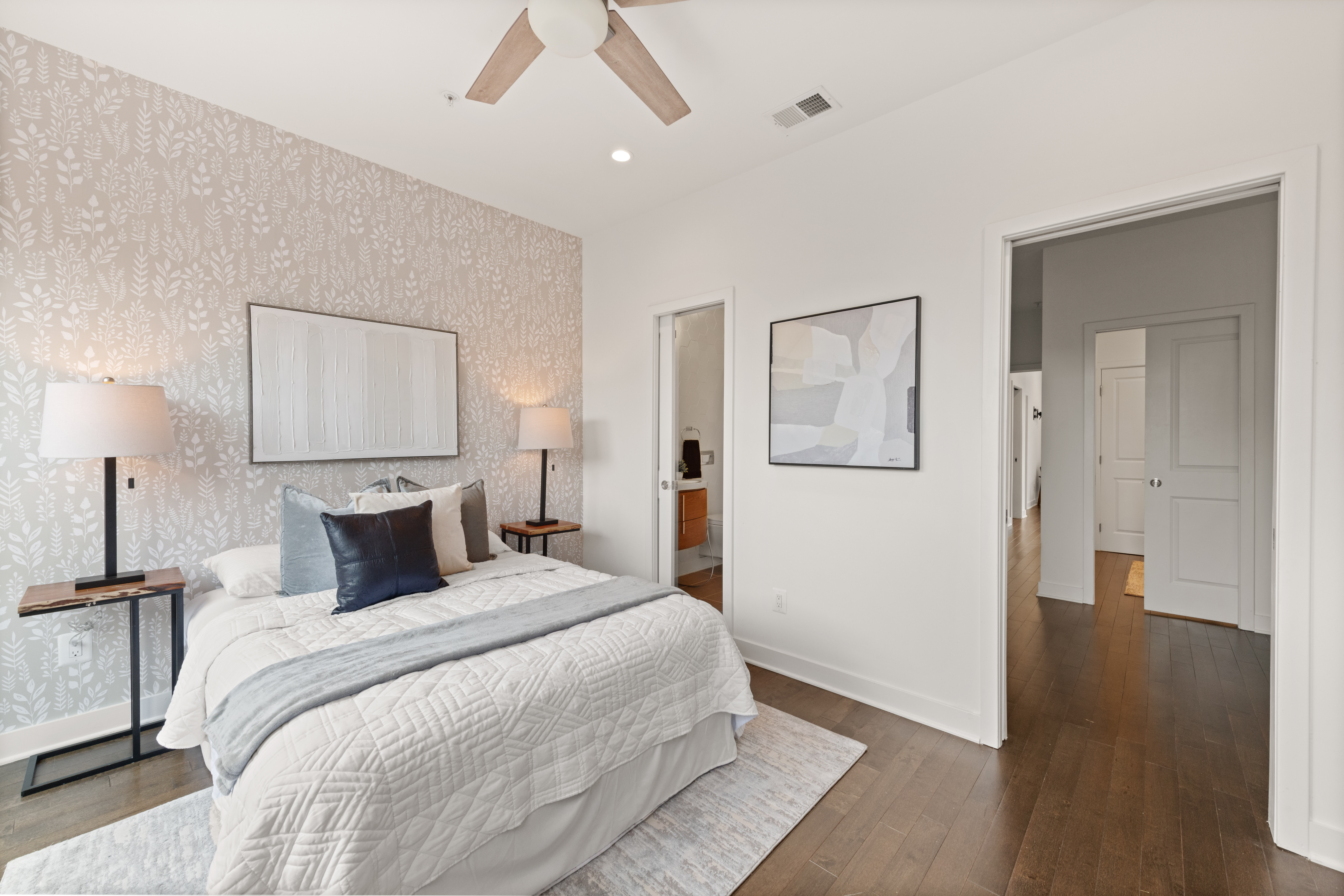 319 Varnum Street Northwest, Unit 3 Washington, DC 20011 - Photo 14 of 29 a bedroom with a bed and a painting on the wall